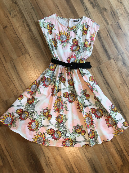 a flat lay of the summer flower dress